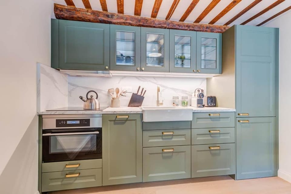 Kitchen or kitchenette, dishwasher, oven, stove, toaster