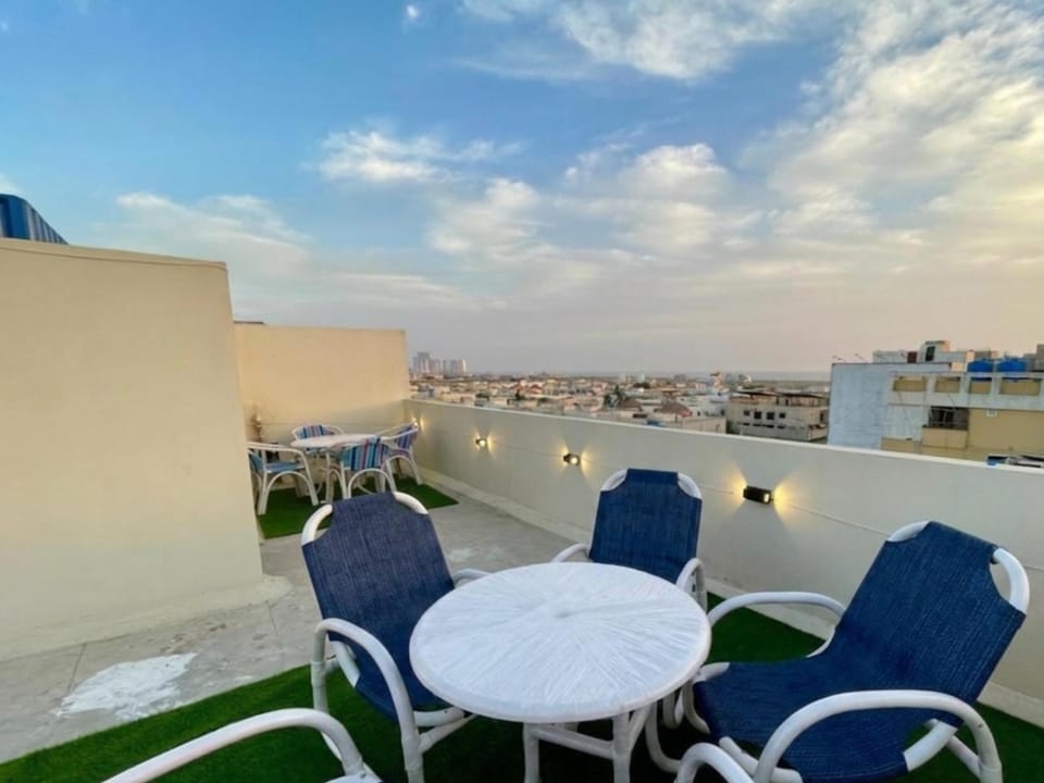 Property building, Patio, Day, View (from property/room), Balcony/Terrace, Living room, Seating area, City view