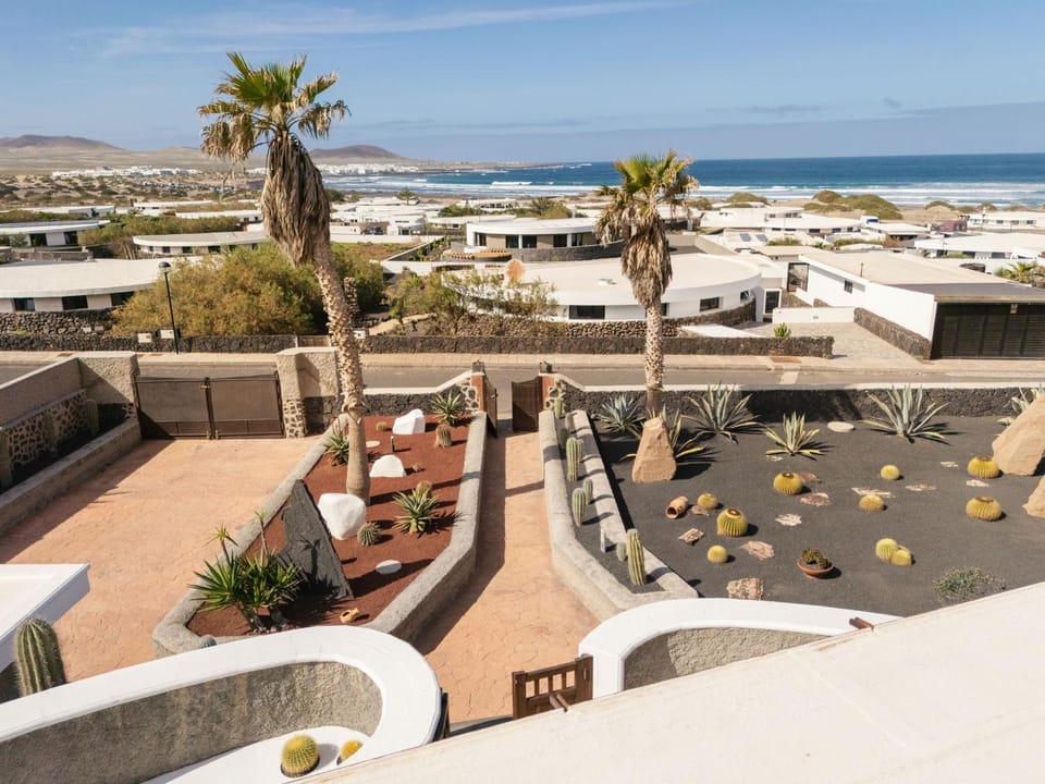 Property building, Patio, Day, Natural landscape, View (from property/room), Balcony/Terrace, Living room, Seating area, Beach, City view, Mountain view, Sea view