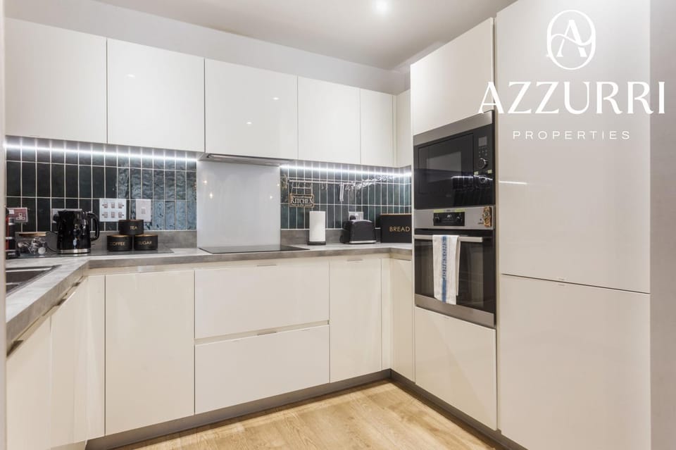 Kitchen or kitchenette, dishwasher, oven, stove, toaster