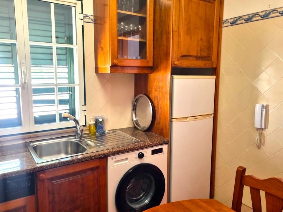 Kitchen or kitchenette, washing machine