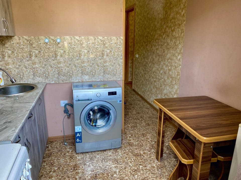 Kitchen or kitchenette, washing machine