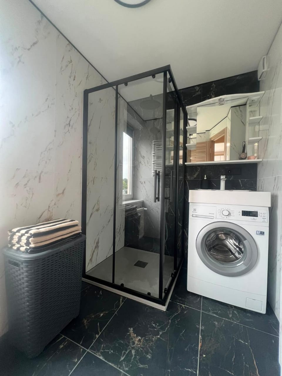 Shower, hair dryier, towels, washing machine