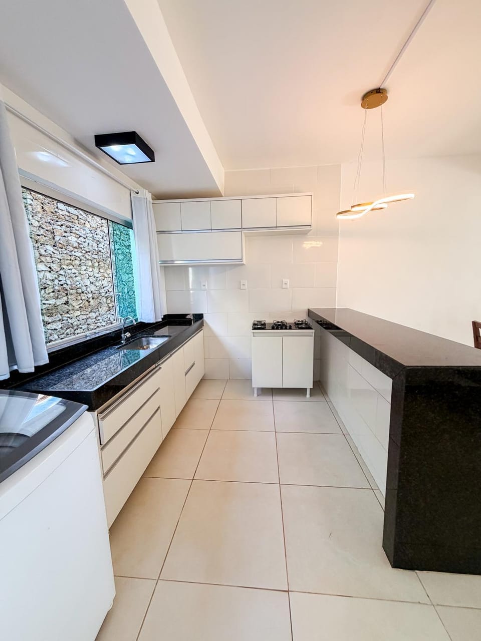 Kitchen or kitchenette, microwave, stove, laundry