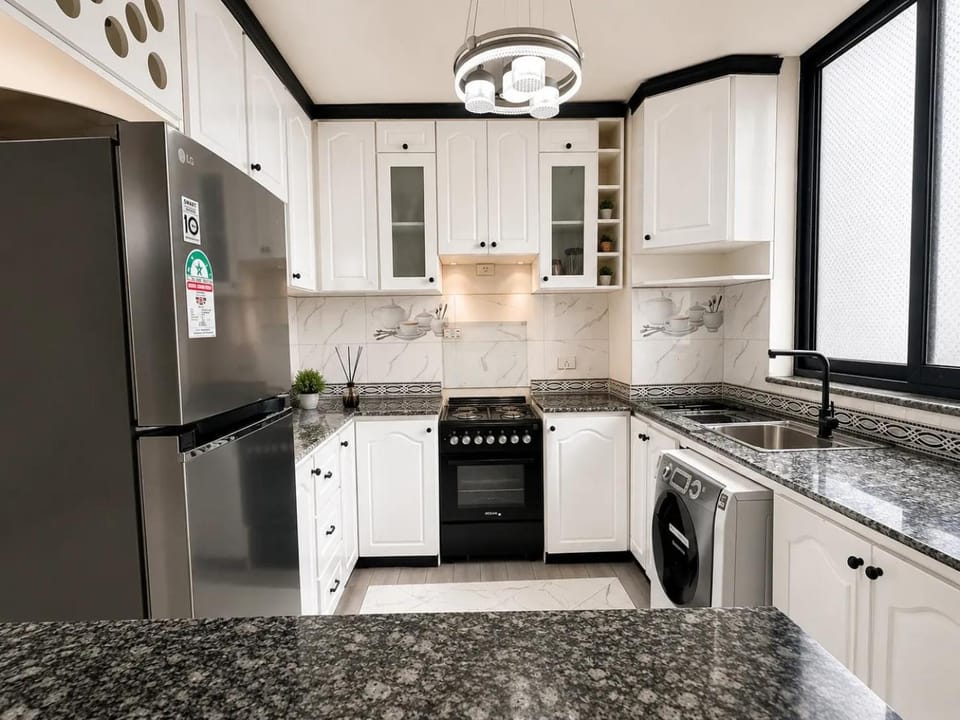 Kitchen or kitchenette, stove, washing machine