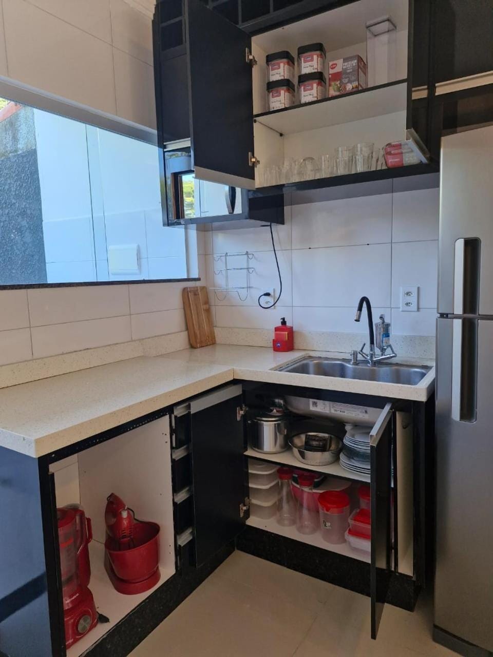 Kitchen or kitchenette, microwave, oven, stove