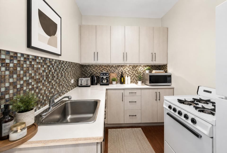 Kitchen or kitchenette, dishwasher, oven, stove, toaster