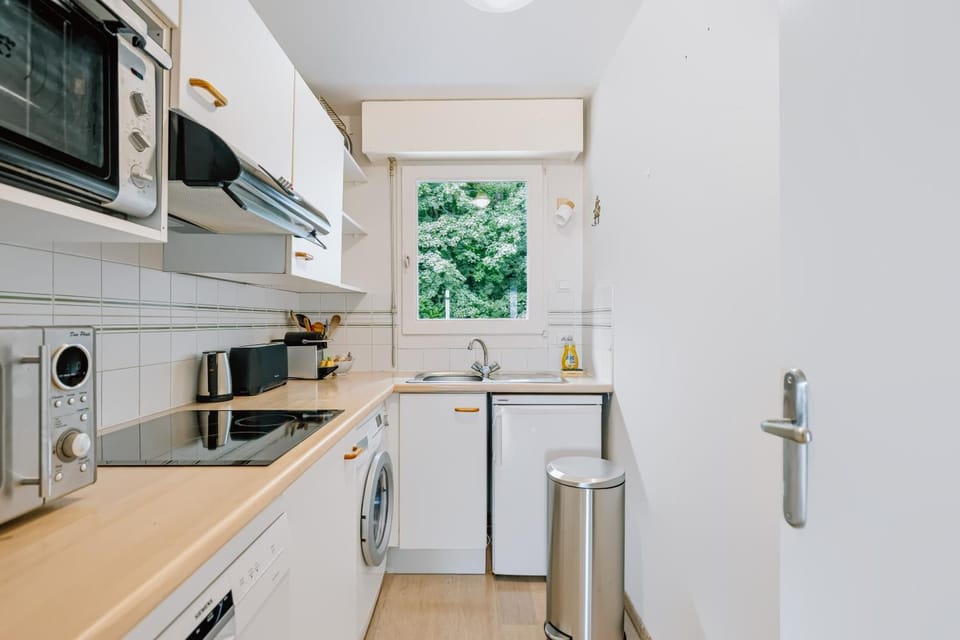 Kitchen or kitchenette, dishwasher, oven, stove, toaster, washing machine