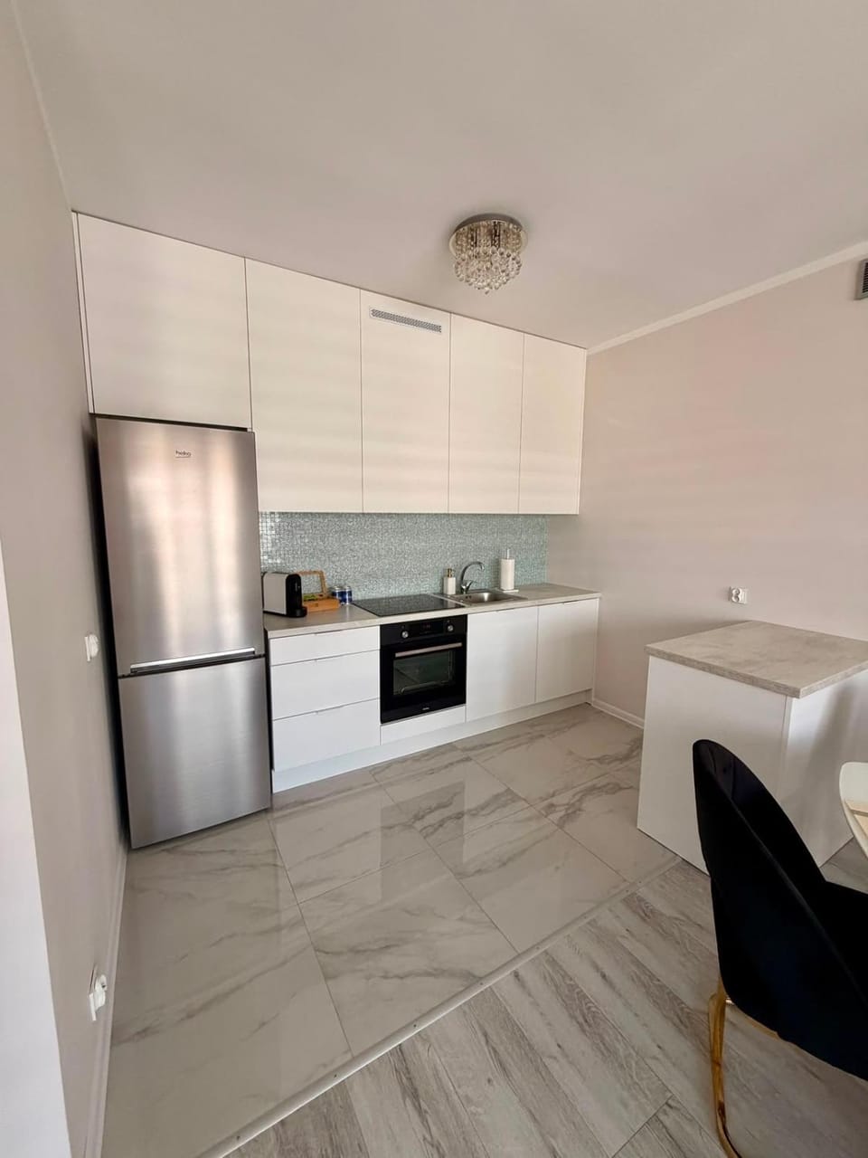 Kitchen or kitchenette, dishwasher, oven, stove