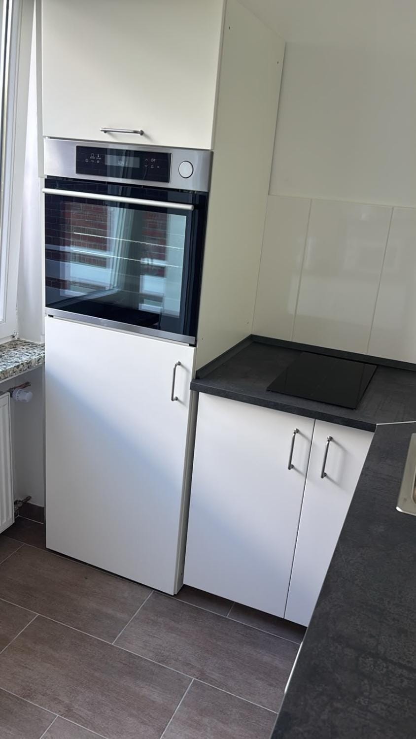 Kitchen or kitchenette, dishwasher, oven, stove