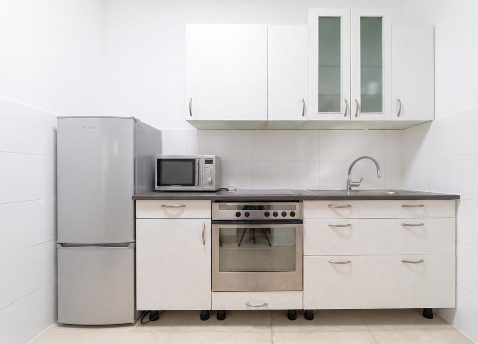 Kitchen or kitchenette, oven, stove