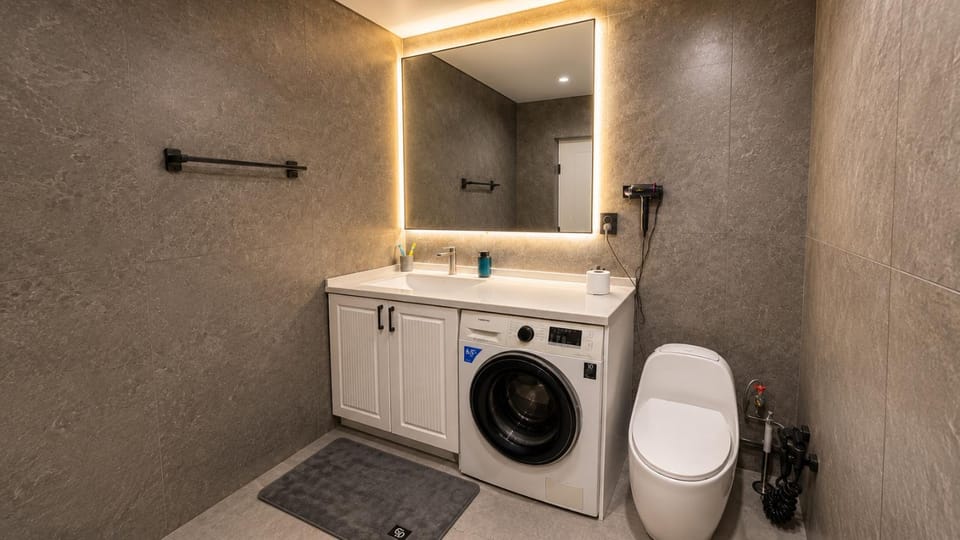Bathroom, hair dryier, washing machine