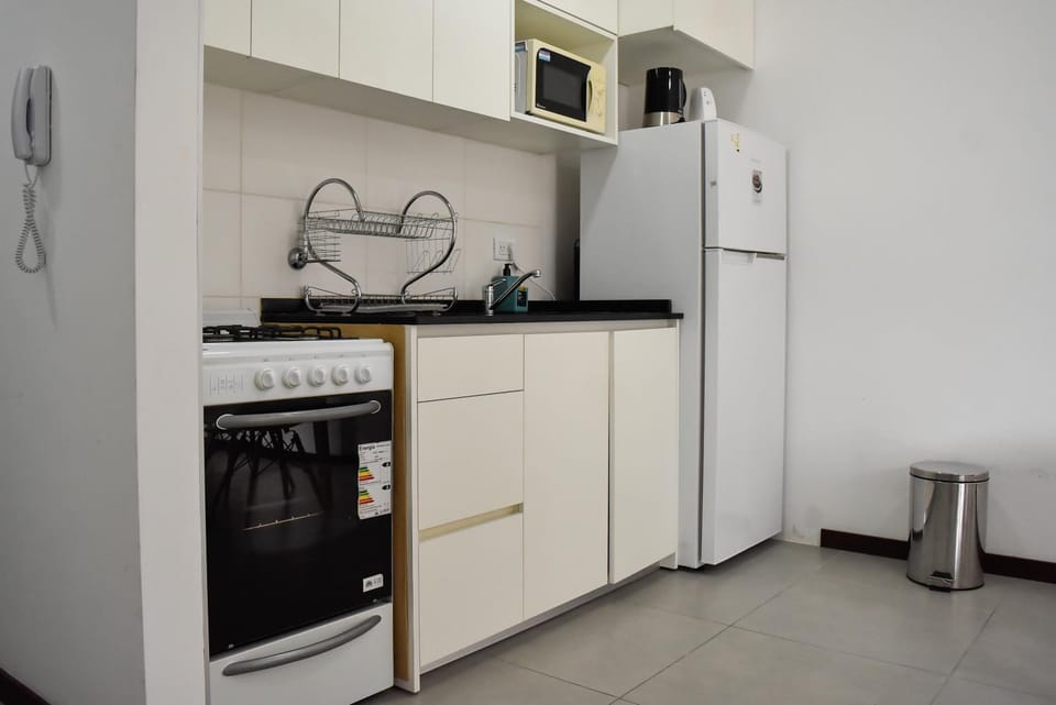 Kitchen or kitchenette, oven, washing machine, dryer