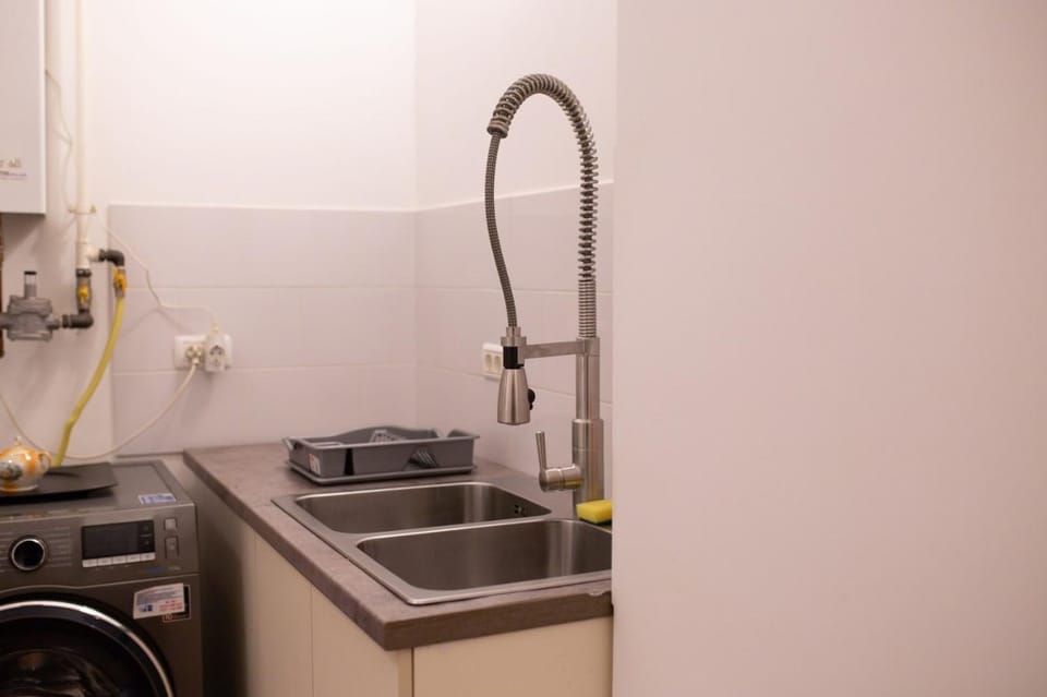 Kitchen or kitchenette, washing machine