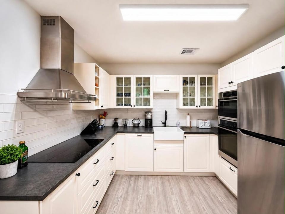 Kitchen or kitchenette, dishwasher, oven, stove