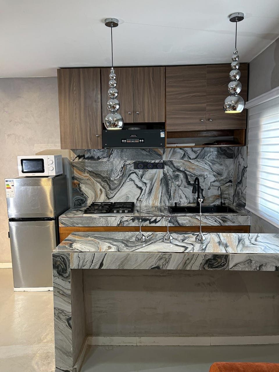 Silver studio with ambient light, airy Apartment in Douala