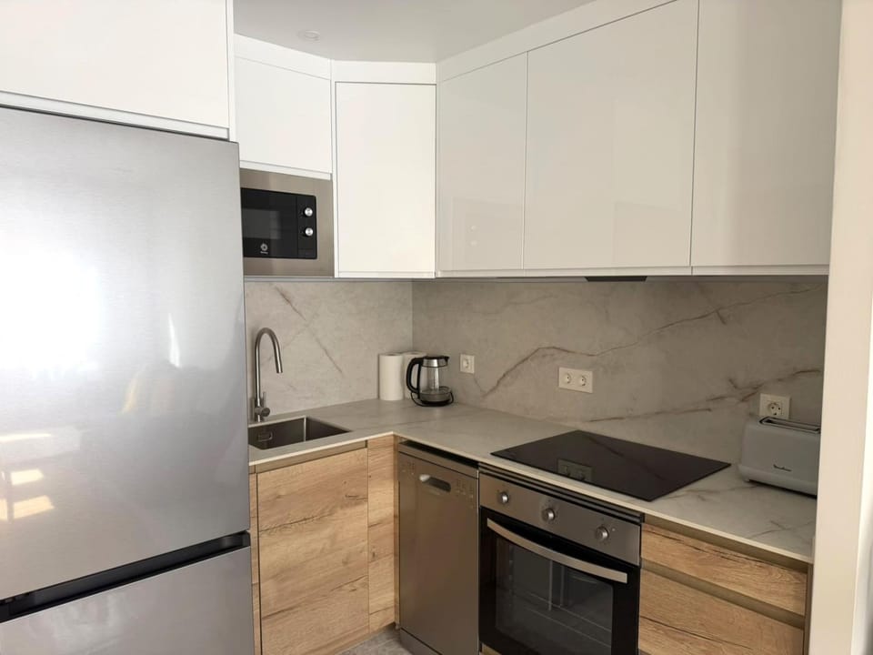 Kitchen or kitchenette, dishwasher, oven, stove, toaster