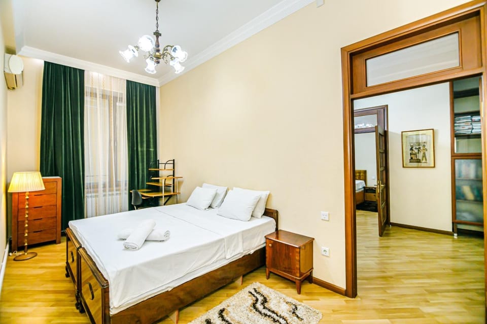 Bed, towels, wardrobe