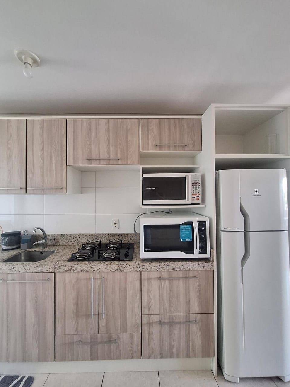 Kitchen or kitchenette, microwave, oven, stove