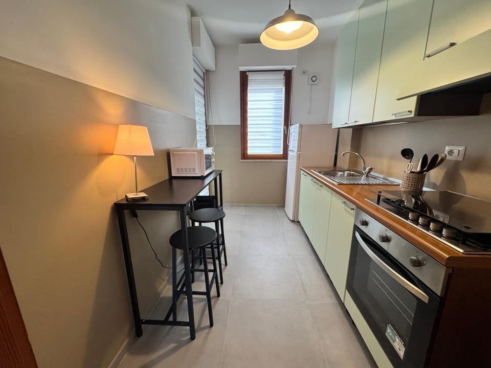 Kitchen or kitchenette, oven, stove