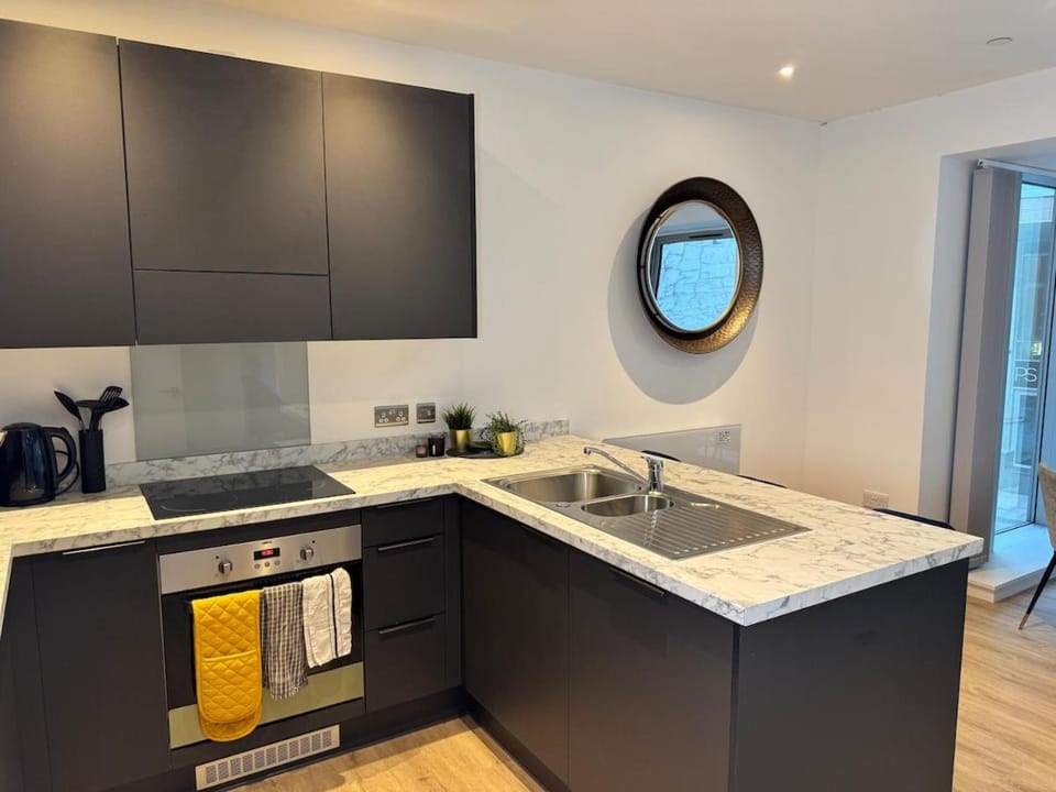 Floor-to-Ceiling Windows with Kitchen Island Apartment in Liverpool