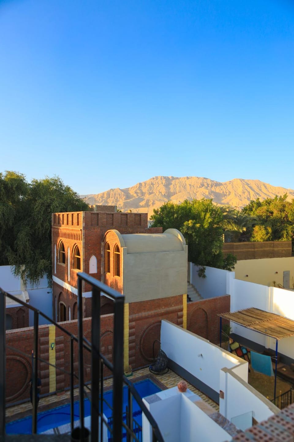 Property building, Patio, Day, Natural landscape, View (from property/room), Balcony/Terrace, Mountain view, Pool view, Swimming pool, sunbed
