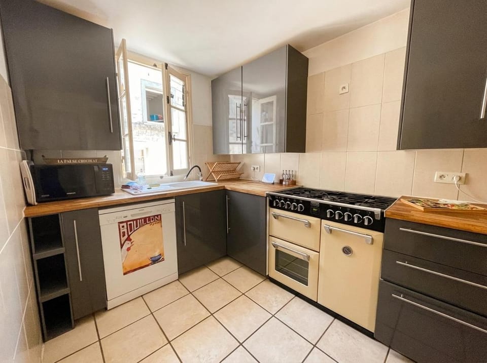Kitchen or kitchenette, dishwasher, oven, stove, washing machine, dryer