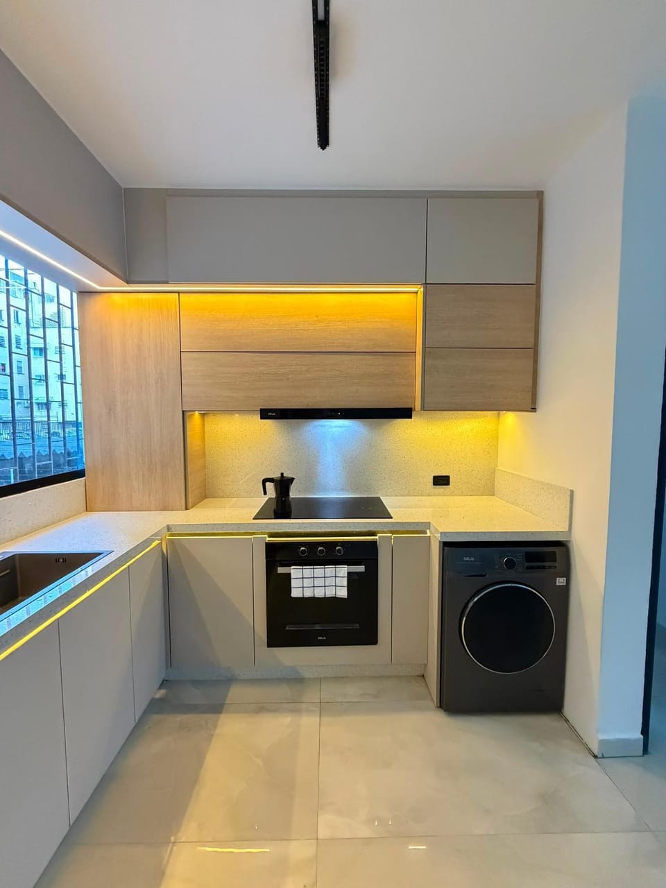 Kitchen or kitchenette, stove, washing machine, dryer
