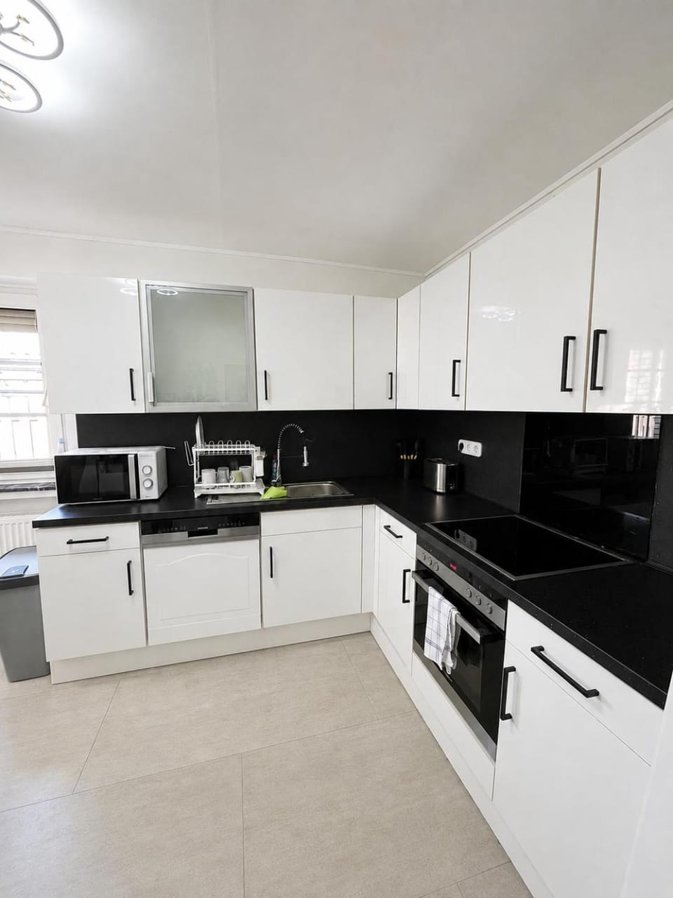 Kitchen or kitchenette, dishwasher, oven, stove, toaster