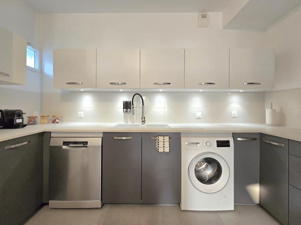 Kitchen or kitchenette, dishwasher, oven, stove, washing machine
