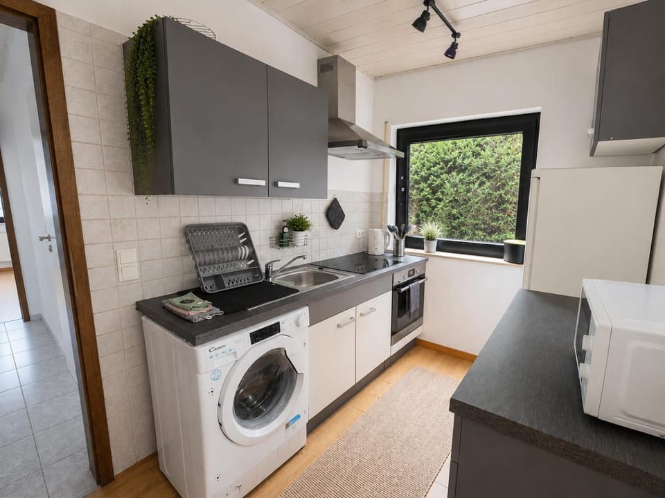 Kitchen or kitchenette, dishwasher, stove, toaster, washing machine, kitchen