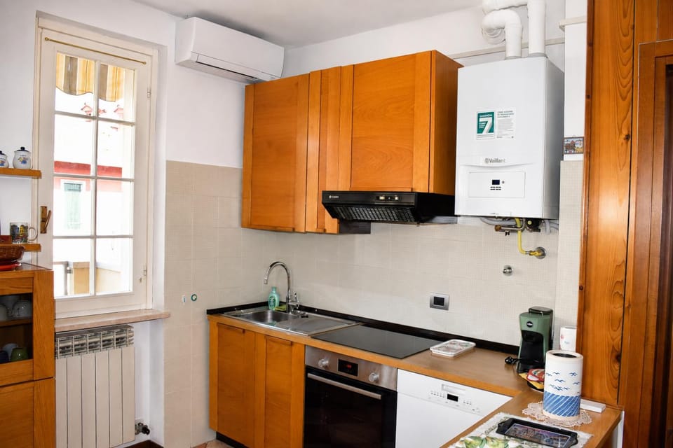 Kitchen or kitchenette, dishwasher, oven, stove
