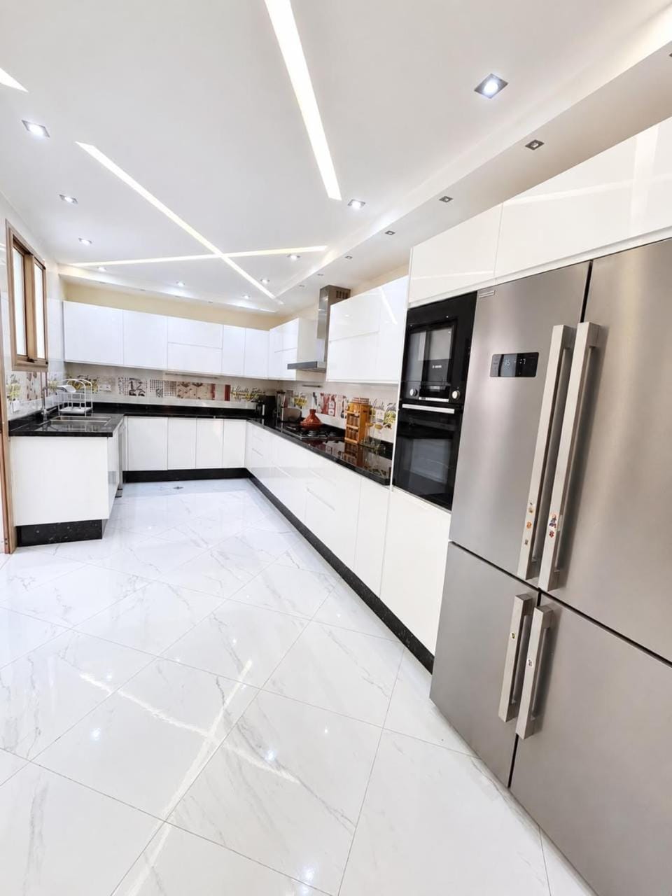 Kitchen or kitchenette, dishwasher, oven, stove