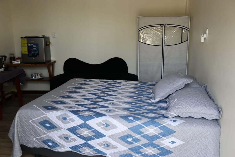 Cozy bedroom in Cumbres del Nacimiento Bed and Breakfast in El Salvador