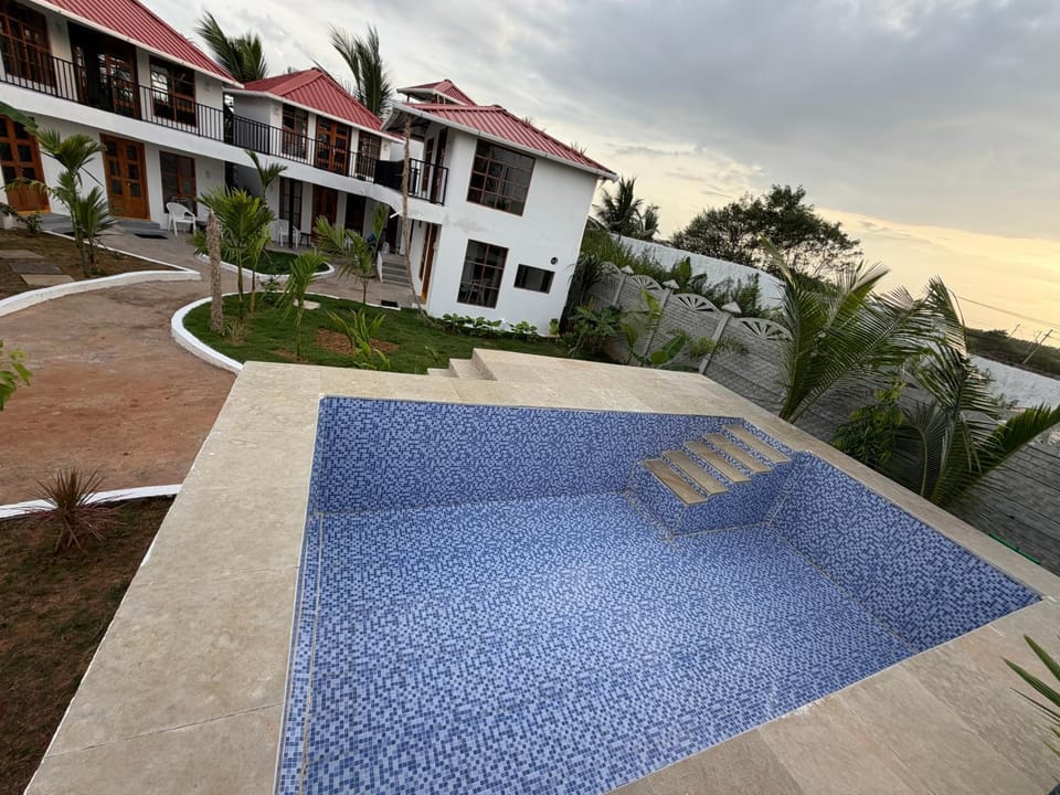 Property building, Patio, Natural landscape, Garden, Garden view, Pool view, Swimming pool