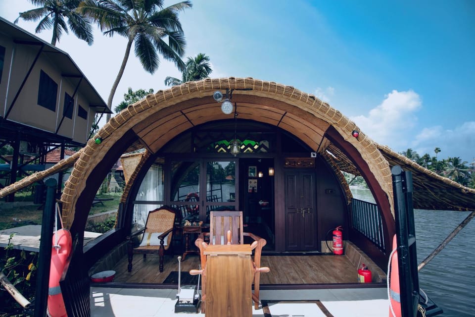 Traditional Luxury Houseboat Island of Hope -Alleppey Docked boat in Kerala