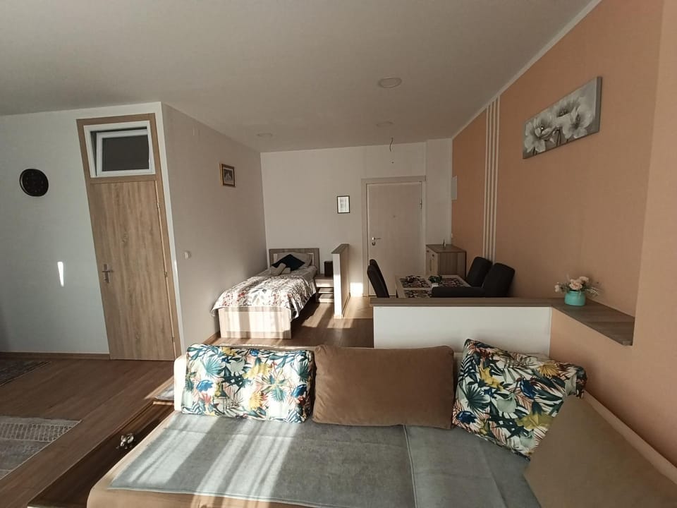Bed, Living room, Seating area, Dining area