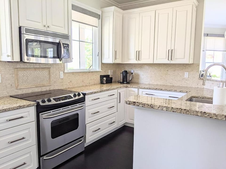 Experience luxury in this 4-bedroom home with stunning lake views in Bay Harbor. House in Bay Harbor