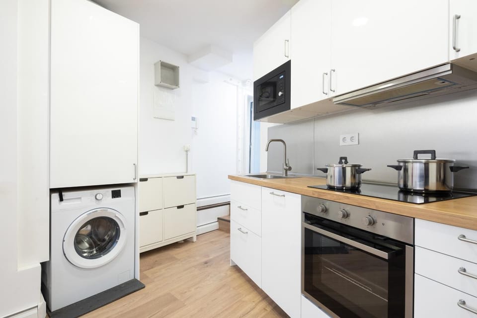 Kitchen or kitchenette, dishwasher, oven, stove, washing machine