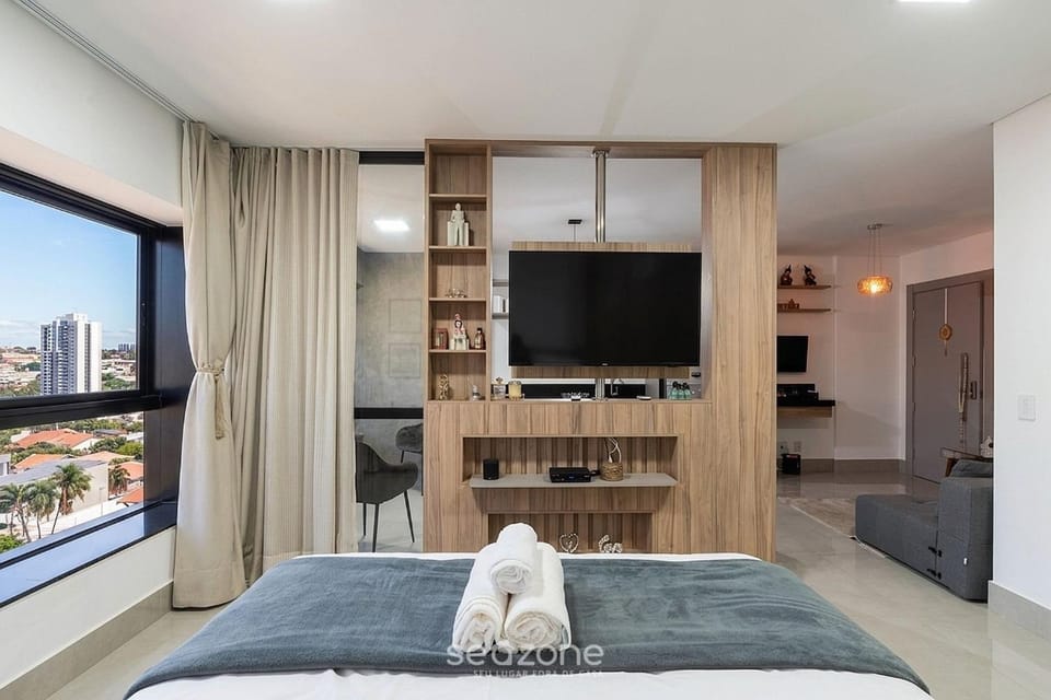 Bed, TV and multimedia, Seating area, Bedroom, City view