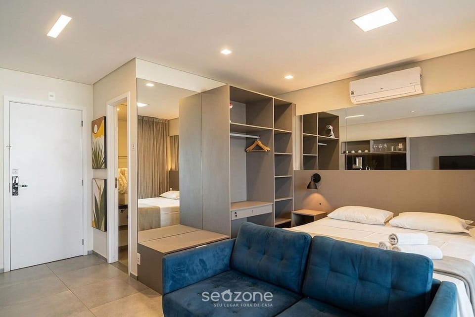 Bed, TV and multimedia, Living room, Seating area, Bedroom