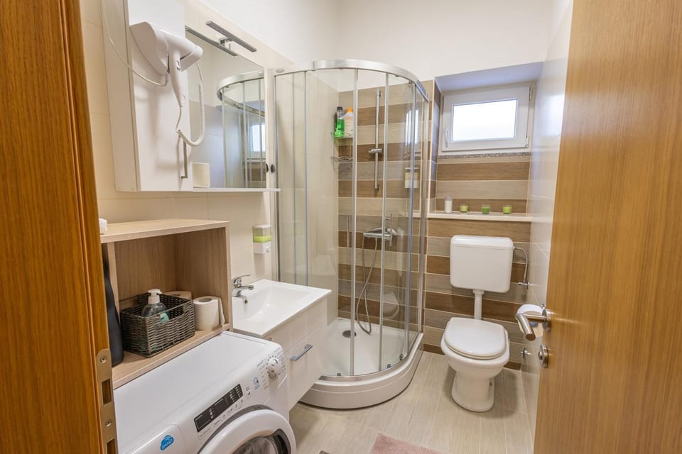 Shower, Toilet, Bathroom, towels, washing machine, dryer