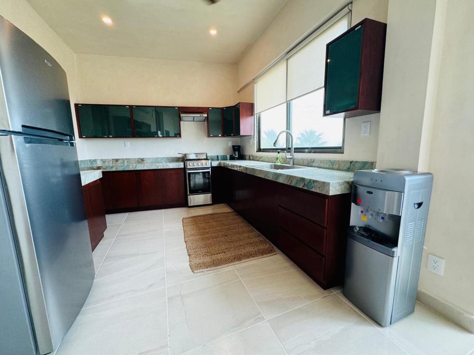Kitchen or kitchenette, dishwasher, oven, stove