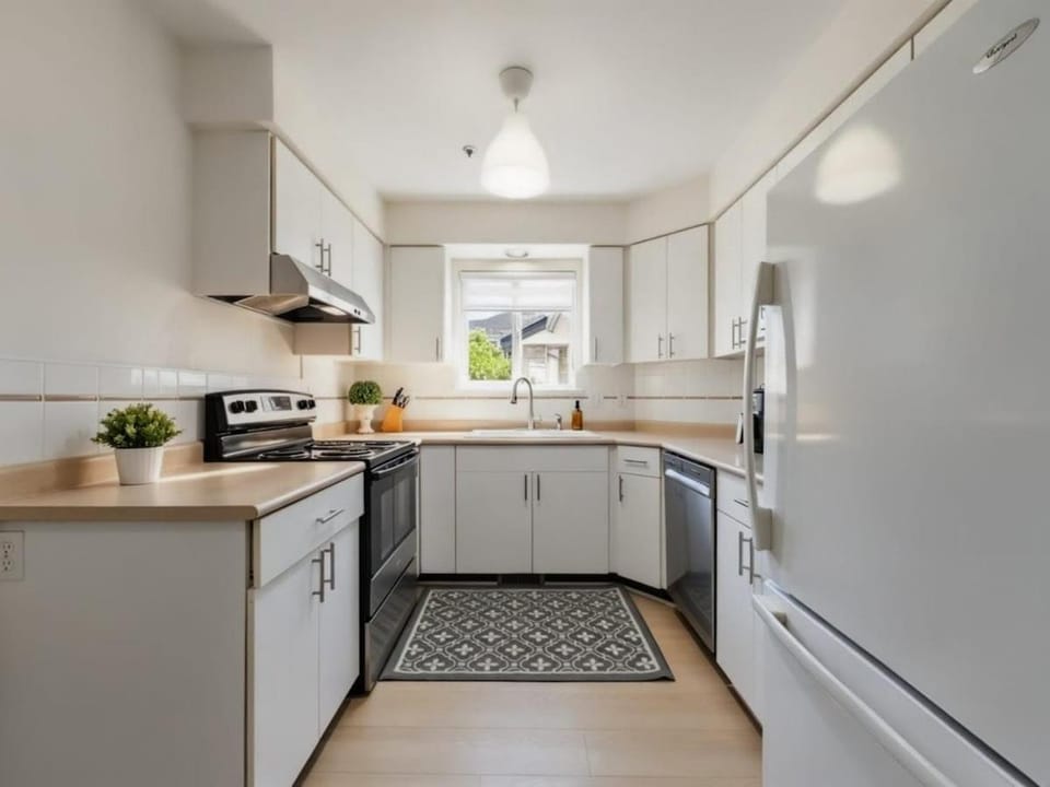 Kitchen or kitchenette, dishwasher, oven, stove, toaster
