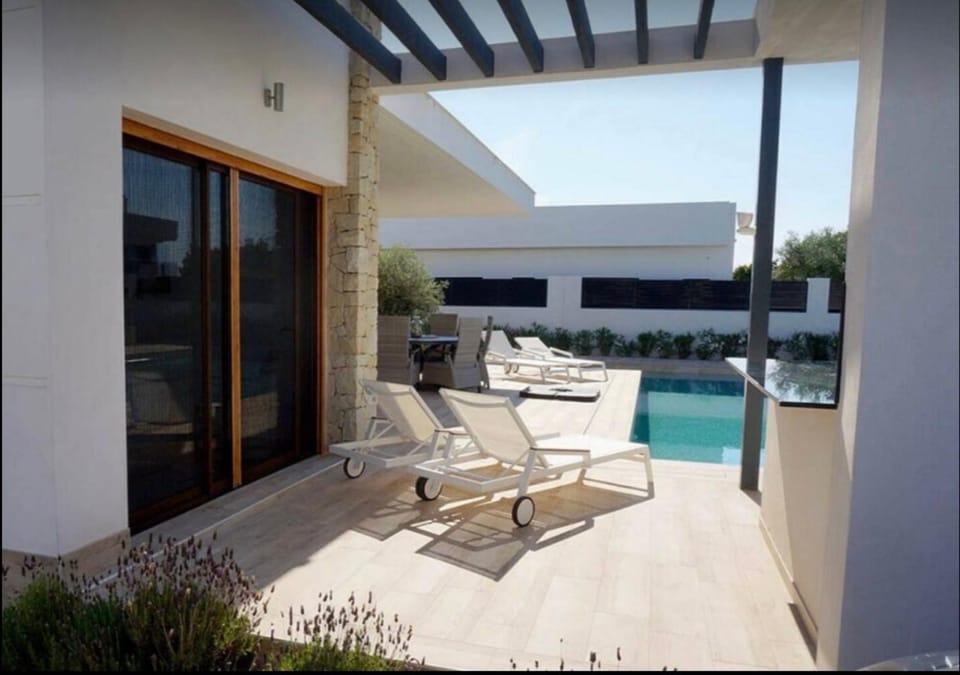 Property building, Living room, Swimming pool
