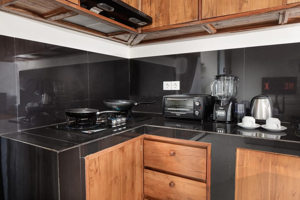 Kitchen or kitchenette, microwave, stove, toaster