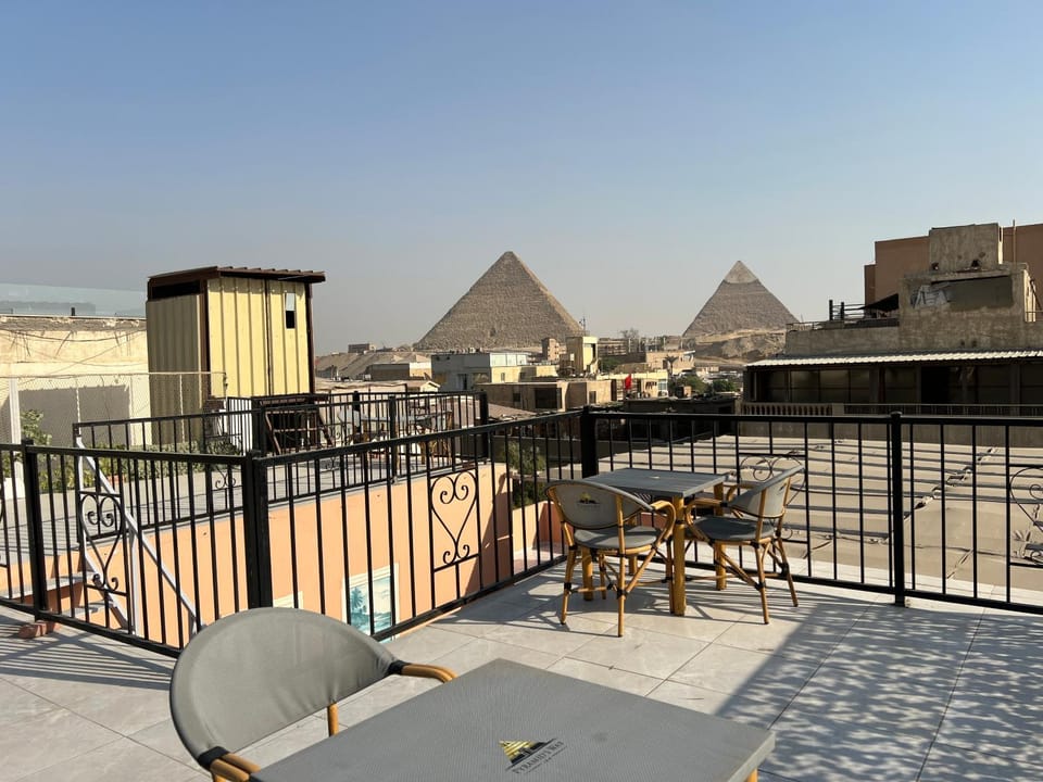Property building, Patio, Nearby landmark, Day, Natural landscape, View (from property/room), Balcony/Terrace, Dining area, City view