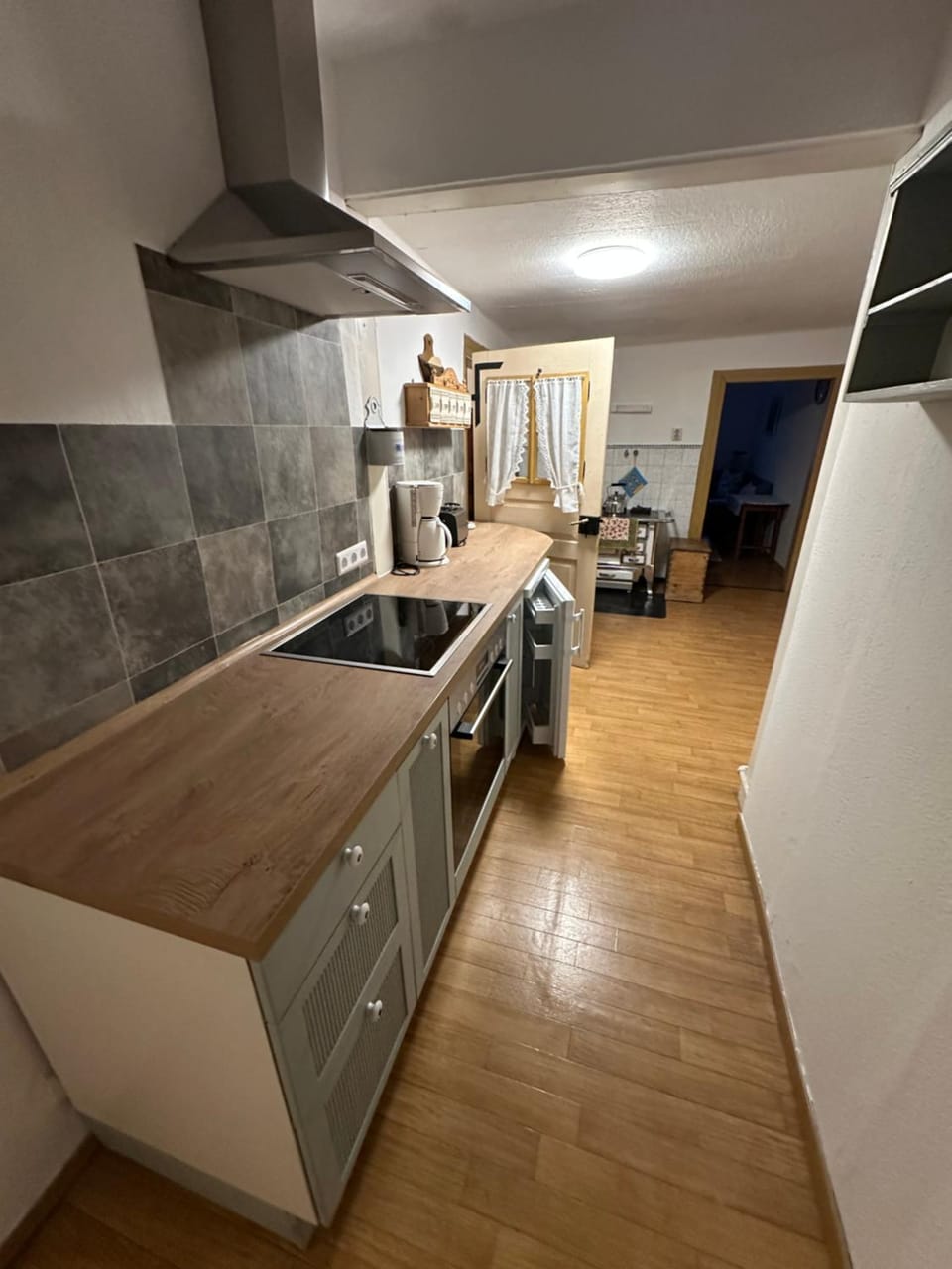 Kitchen or kitchenette, dishwasher, oven, stove