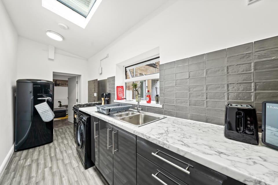 Kitchen or kitchenette, oven, stove, toaster, washing machine, dryer