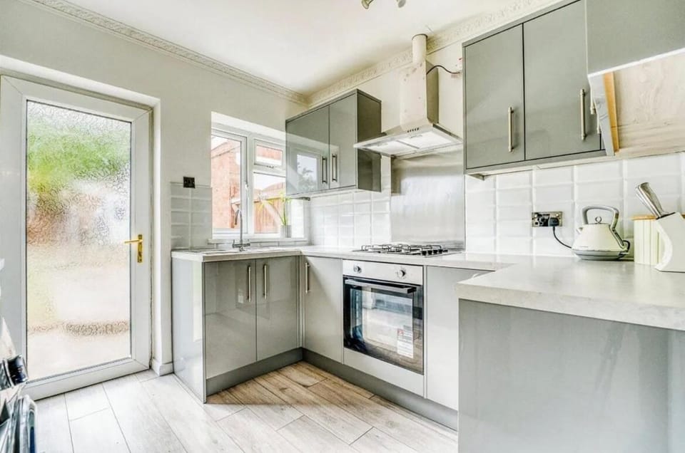 Kitchen or kitchenette, dishwasher, oven, stove